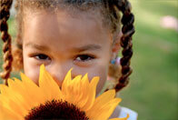 Child with a sunflower