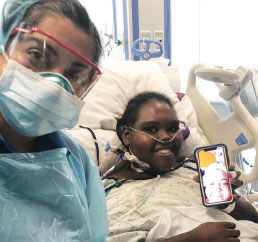Kimesha
Smith with Deepa Iyer, MD, and
her mom on FaceTime