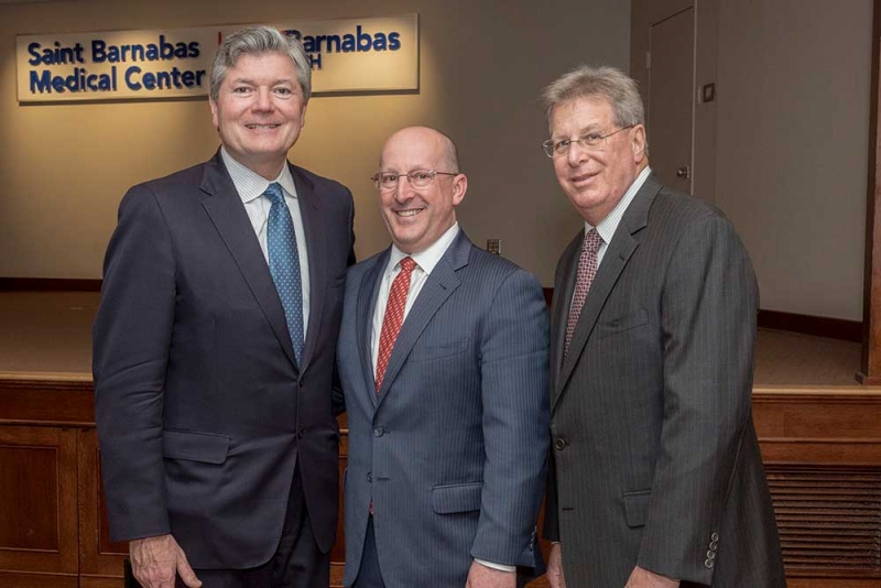 Stephen P. Zieniewicz, FACHE, president and chief executive officer at Saint Barnabas Medical Center (left), and Michael Scoppetuolo, M.D., chief medical officer of the Cancer Center at Saint Barnabas Medical Center (right), join Steven K. Libutti, M.D., FACS,