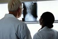 physicians reading radiology films