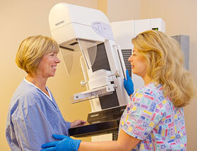 Nurse With Woman Preparing for Mammogram