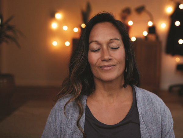 Woman meditating demonstrating coping skills for stress