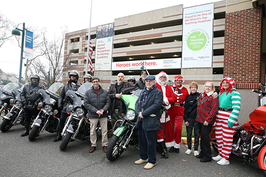 Front row from right, Robert Zanni, M.D., Chief of Pediatric Pulmonology, and Jonathan Teitelbaum, Chair of Pediatrics, gather with ride organizer Bill Blakely of Creative Performance, center, and riders from the Blue Knights NJ XV and Jersey Shore HOGs and local police departments.