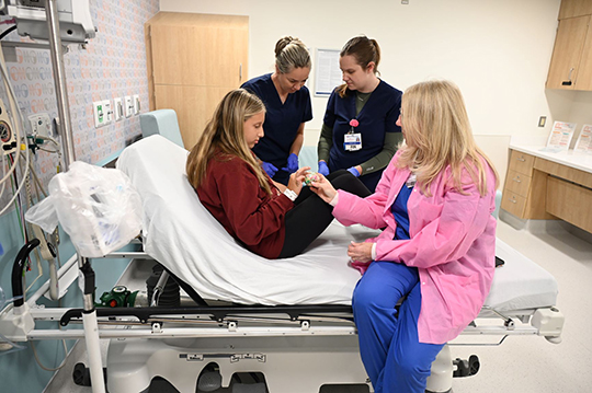 BMSCH Same Day team with young patient