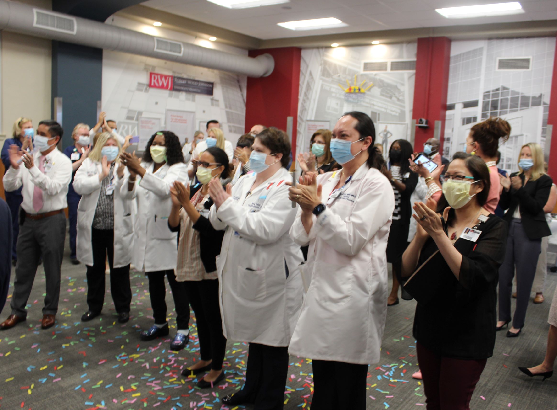 Nurses and staff clapping, celebrating RWJ University Hospital's Sixth Magnet Designation for Nursing Excellence