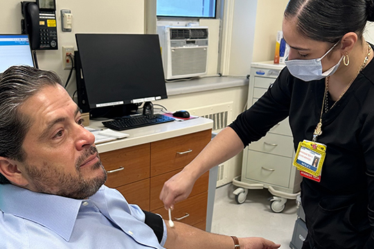 Mark Manigan donating blood