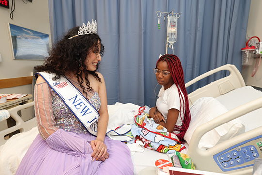 Miss New Jersey with young patient