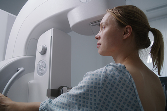 Woman getting mammogram
