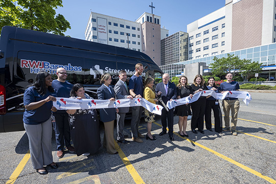 RWJBarnabas Health leadership, Trinitas Regional Medical Center staff, and local officials cut the ribbon for the Street Medicine Program.