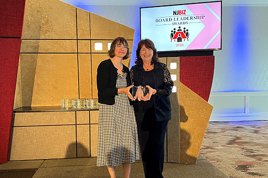 Susan Reinhard with award at presentation