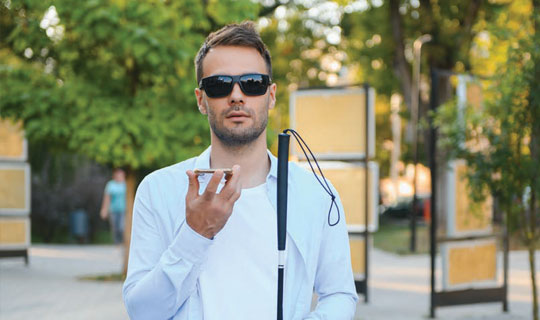 blind man talking into his phone