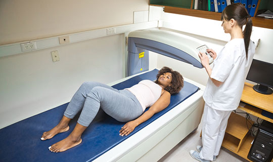 woman being screened for bone density