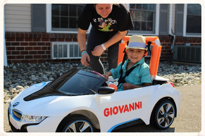 kid in a toy car