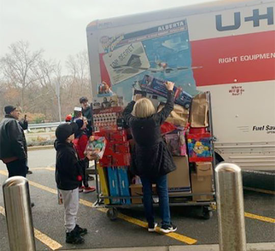 Michael and Michelle Chieffo’s annual toy drive - unpacking the UHaul truck at Clara Maass Medical Center