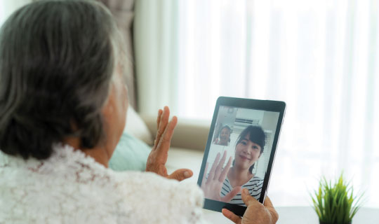 grandmother connecting with granddaughter on facetime