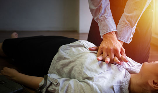 person demonstrating CPR technique