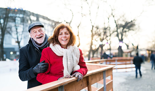 happy senior couple in winter