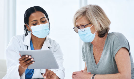 physician speaking with her patient