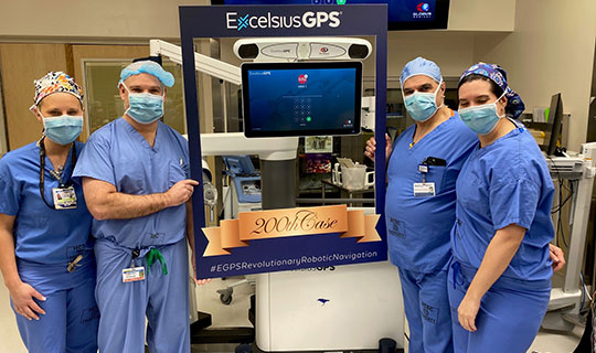 Monmouth Medical Center spine surgeons Marc Menkowitz, MD (left), and Steve Paragioudakis, MD, with nurse practitioner Courtney Kroeze (left), and Certified Perioperative Nurse Jacqueline Passariello