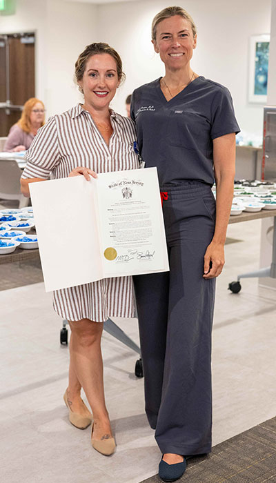 Jenna DiBartolo, left, Acting Vice President, Vogel Medical Campus Project, with Assemblywoman Margie Donlon, who presented the hospital with a legislative proclamation in honor of the mosaic workshops.