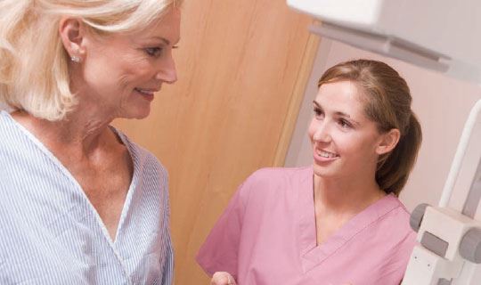 woman getting a mammogram