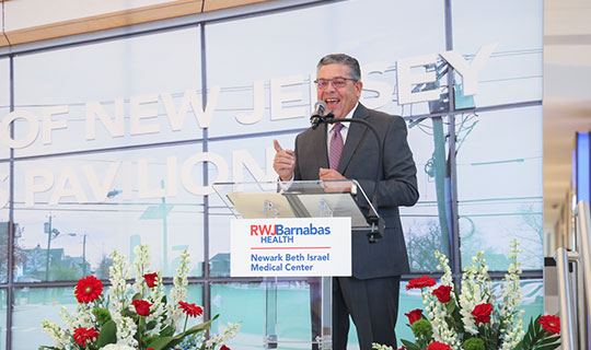 NBIMC Board Chair Frank Giantomasi speaking at the event