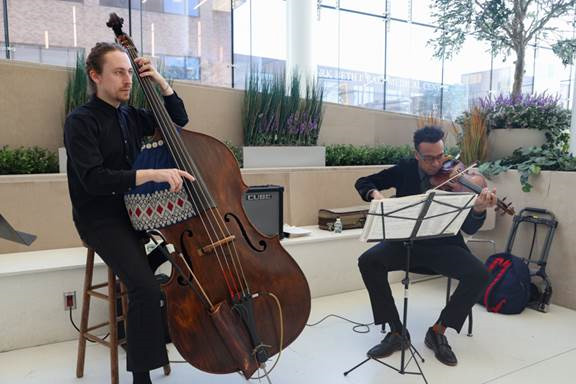 two musicians - a bassist and violinist - playing jazz at Newark Beth Israel Medical Center