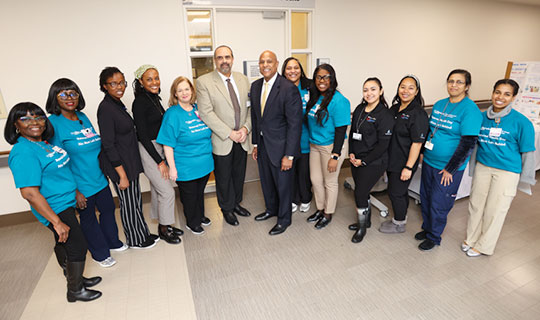 Khalid Sawaged, DO, FACOG, Chairman, Dept. of OB/GYN (center left) and Darrell K. Terry, Sr., mha, mph, fache, fhela, President and Chief Executive Officer, Newark Beth Israel Medical Center and Children’s Hospital of New Jersey (center right) with the teams from the Women’s Health Center, Women’s Health Unit (Labor & Delivery, Post-Partum Mother/Baby) and the Newark Beth Israel Wellness Team at the information tabling event during Maternal Health Awareness Day, Jan. 23, 2024.