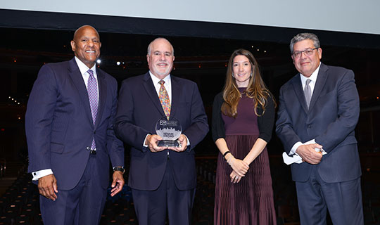 The Valerie Fund and its founders, Ed and Sue Goldstein, receiving the Partners in Progress Corporate Award