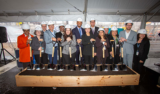 Group with shovels for ground breaking on construction of the South Ward Wellness Center in Newark