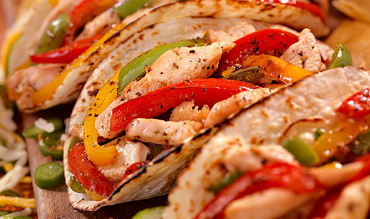 Chicken Fajitas with ingredients cooked on a sheet pan