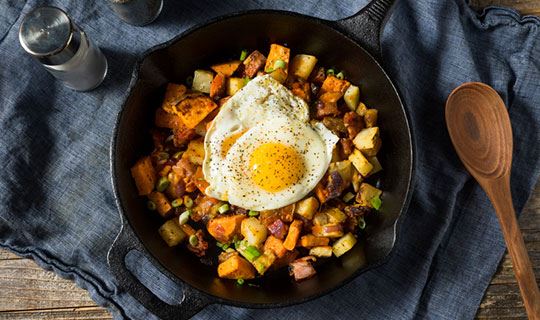 sweet potato hash with a sunny-side up egg on top