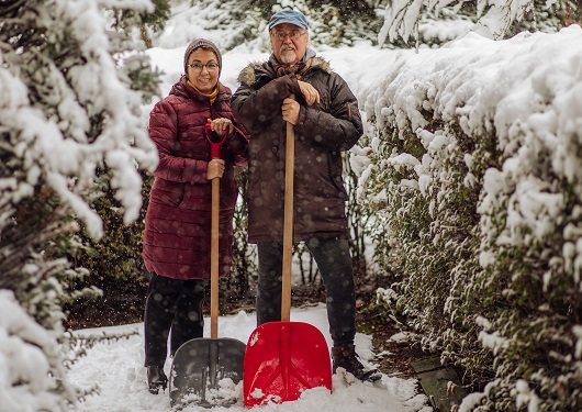 older couple shoveling