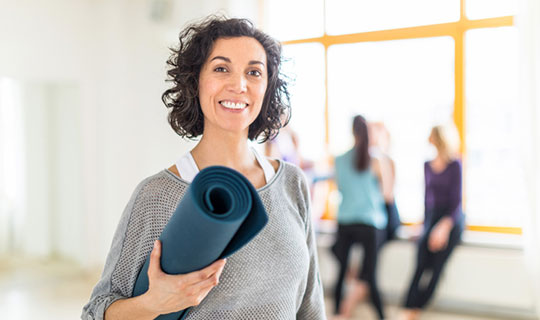 woman with yoga mat