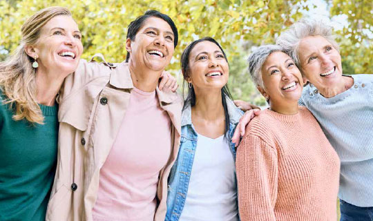 group of 5 women smiling