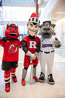 The Rutgers Scarlet Knight, New Jersey Devils N.J., and Somerset Patriots Sparkee help to celebrate the opening of the Jack & Sheryl Morris Cancer Center