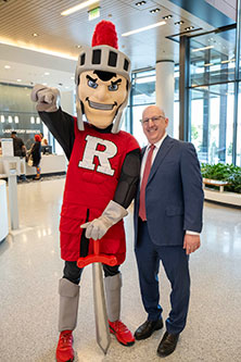 Dr. Steven Libutti, William N. Hait Director of Rutgers Cancer Institute and Senior VP of Oncology Services, RWJBarnabas Health, with the Rutgers Scarlet Knight to commemorate the start of patient care at the Jack & Sheryl Morris Cancer Center