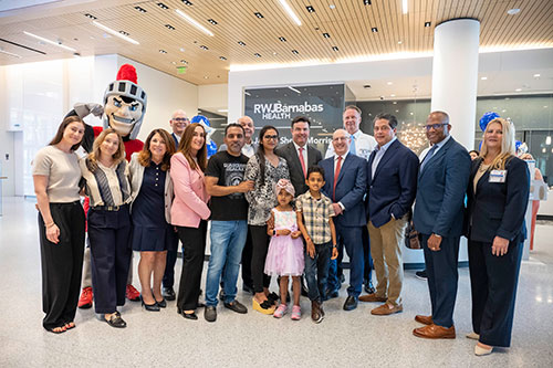 5 year old patient Serina Patel and her family join the leadership of RWJBarnabas Health, Rutgers Cancer Institute and Robert Wood Johnson University Hospital and the Rutgers Scarlet Knight at the opening of the new Jack & Sheryl Morris Cancer Center