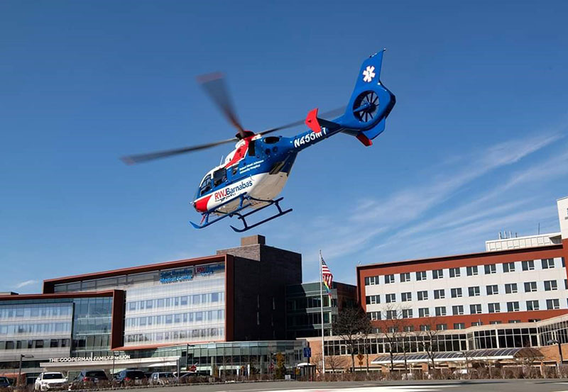 RWJBarnabas Health helicopter flying over Cooperman Barnabas Medical Center