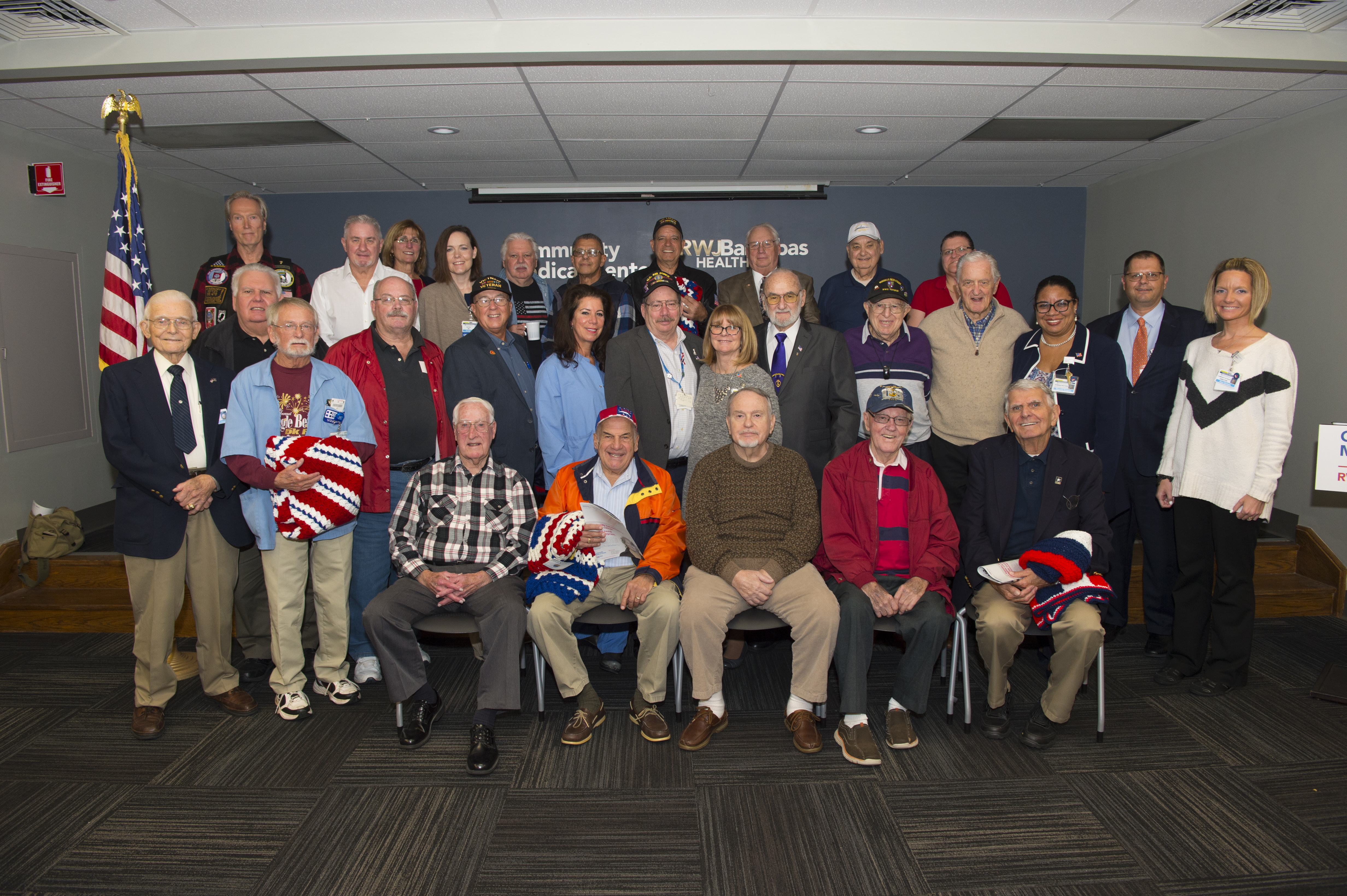 Michael Mimoso, MHSA, FACHE, President & CEO, Community Medical Center (second row, second on right) joined over 30 veterans to thank them for their service to our country at a luncheon held in their honor. 