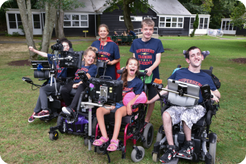 six teens in wheelcharis at camp