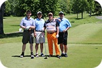 four golfers standing together