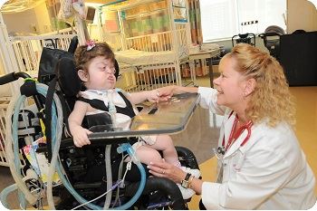 special needs child in wheelchair with doctor