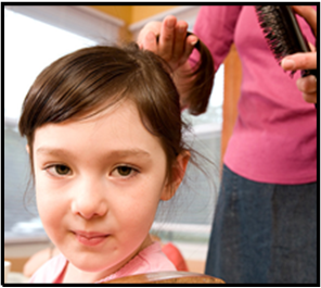 little girl getting hair cut