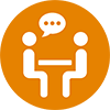 Orange circle with a white icon of two people sitting face to face talking