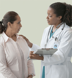Physician talking to patient.