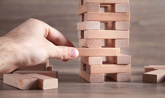 person playing a game of jenga