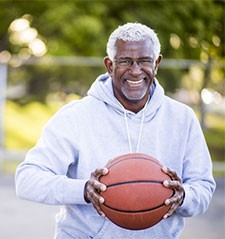 man holding basketball