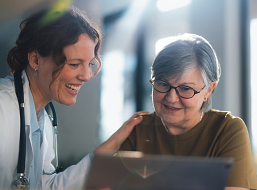 Doctor consulting with patient about breast health screening