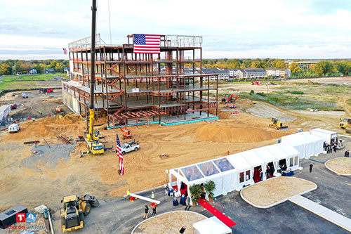View of steel structure for the Specialty and Cancer Care Center before the final beam is raised